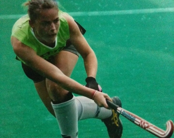 Emilie playing field hockey