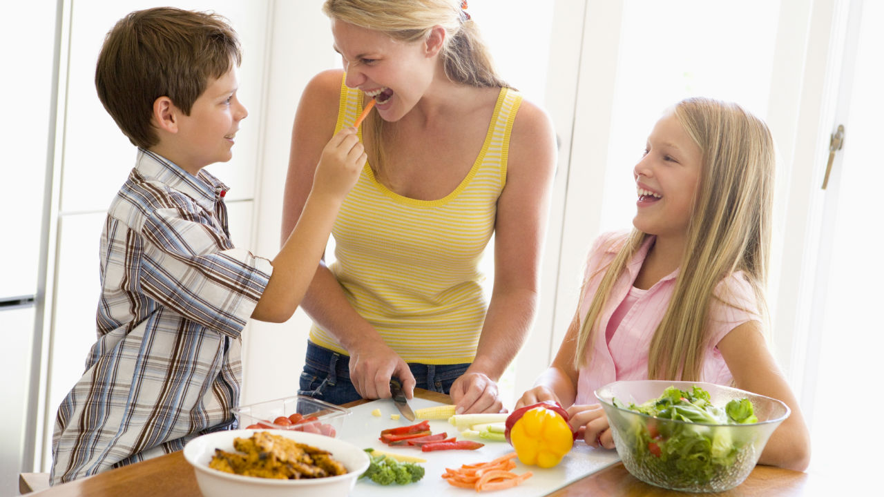 mother and children preparing a meal