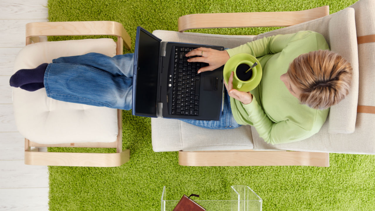 woman in armchair with laptop