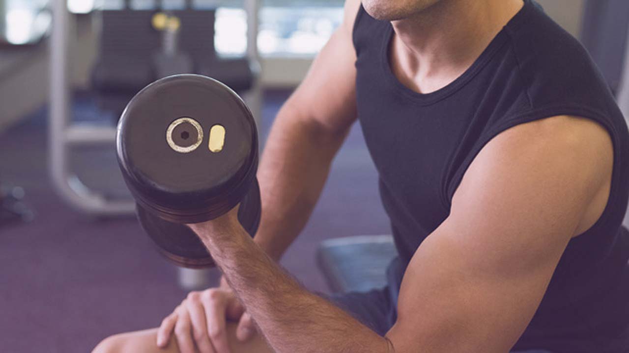 man lifting weights