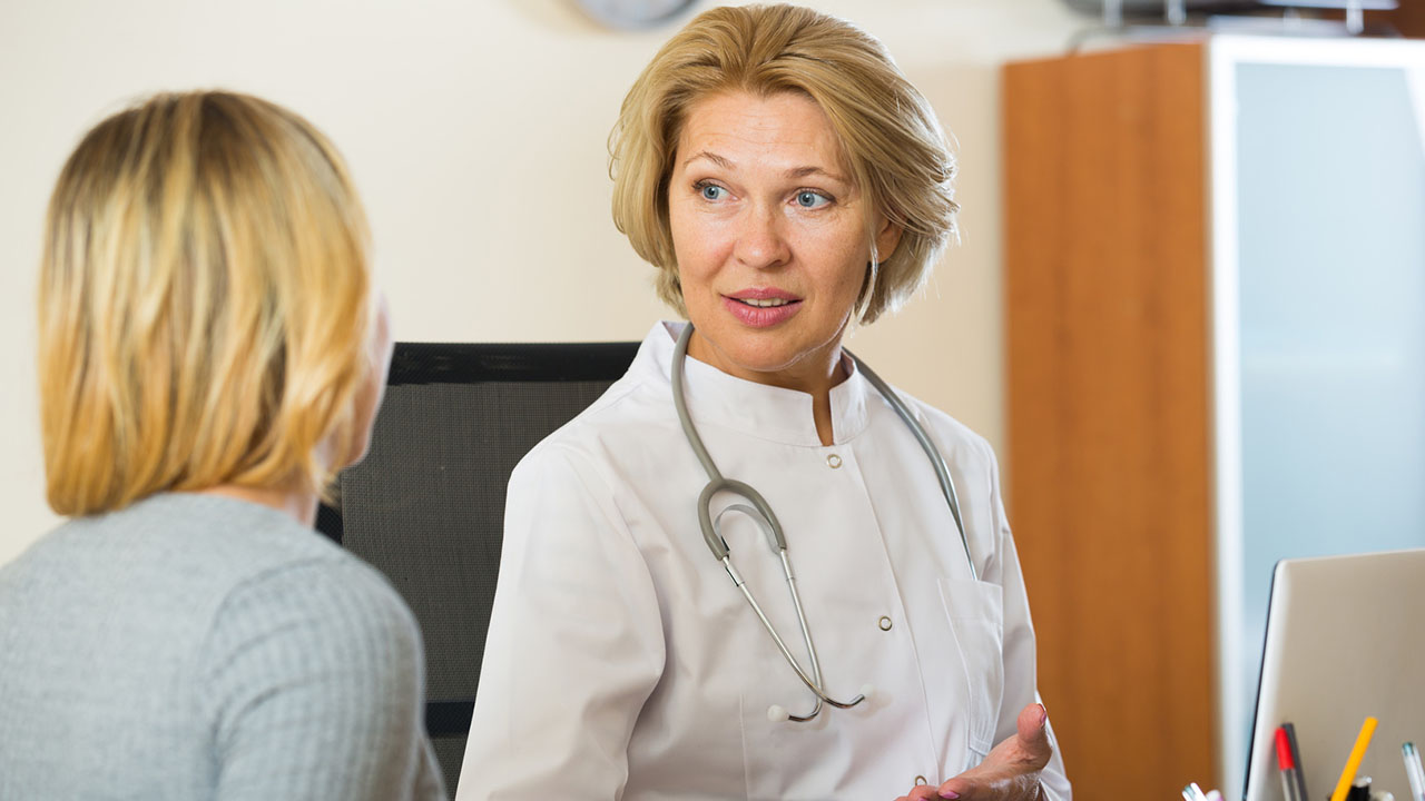 Doctor with female patient