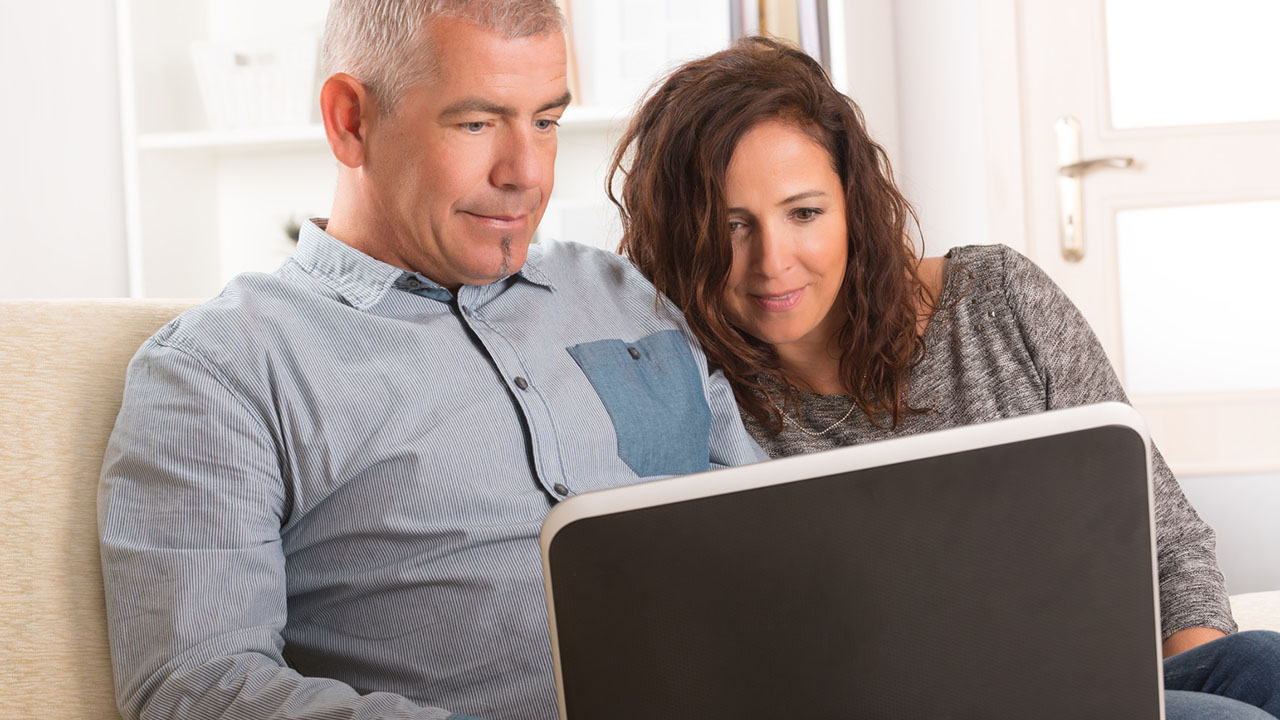 Couple using laptop