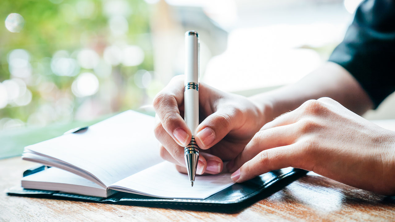 Woman writes in journal