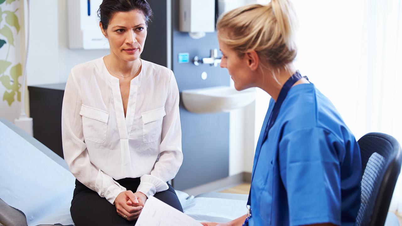 Woman consults with her doctor