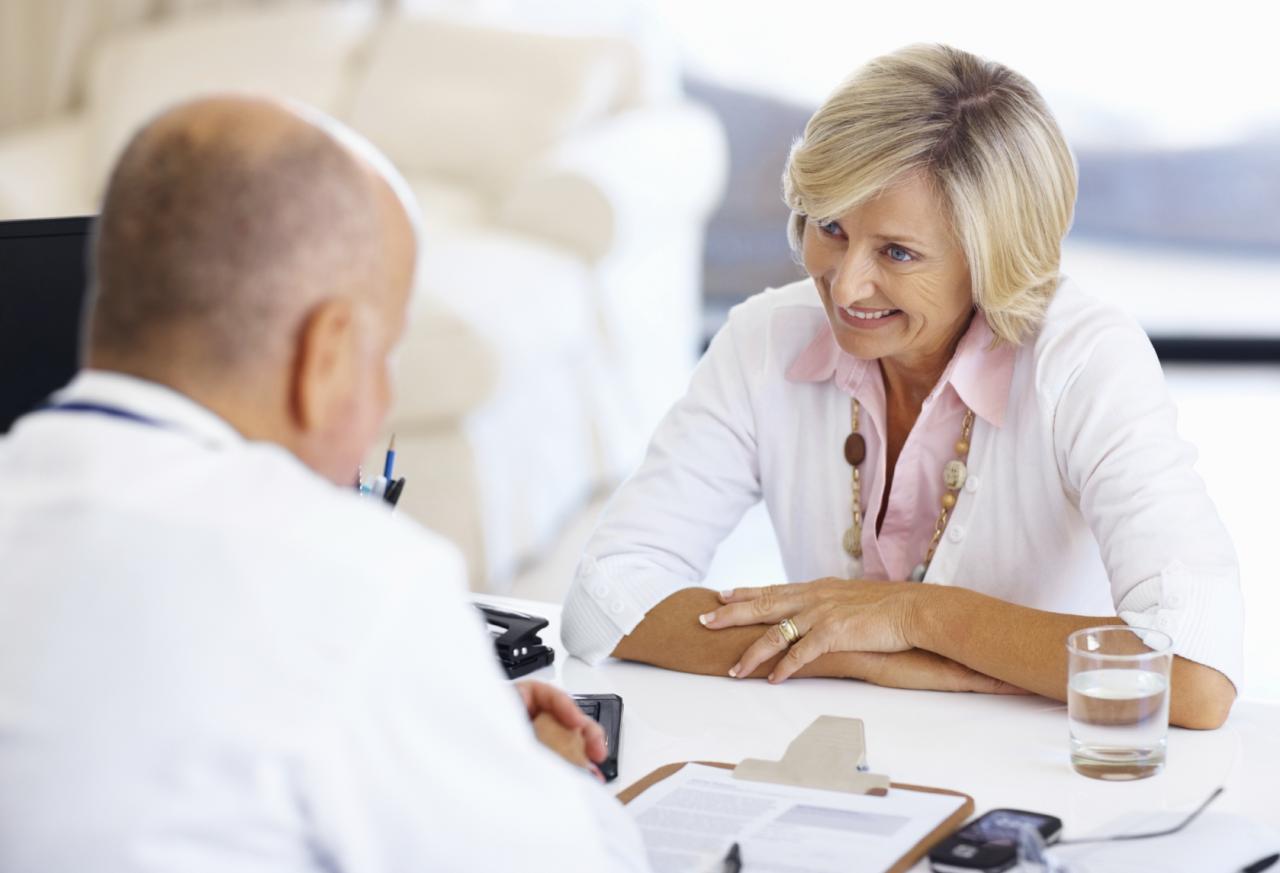 Woman talking with doctor