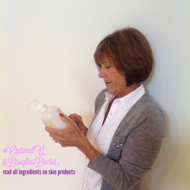 Woman reading label on skincare product
