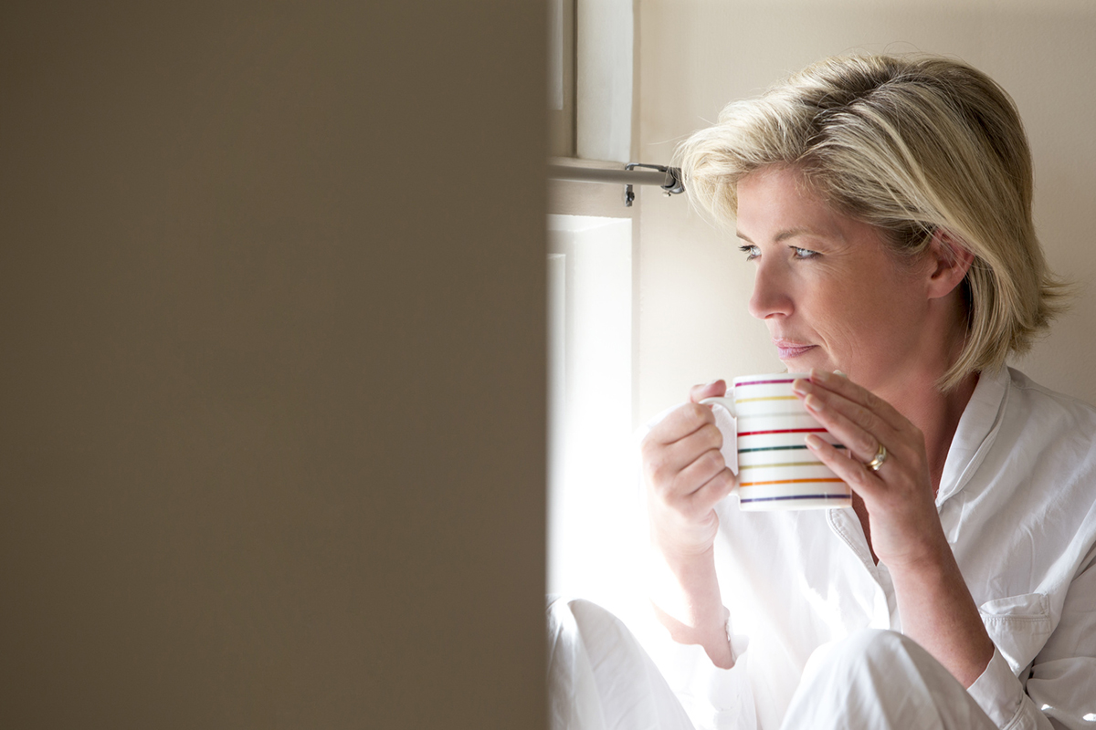 Woman sips coffee